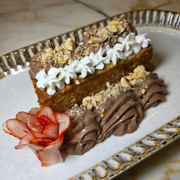 Layered chocolate dessert plated at Crave Café